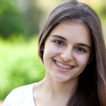 teenage girl smiling with braces